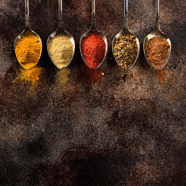 Powder Spices and herbs in old spoons