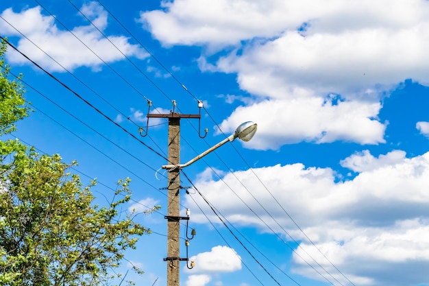 Power electric pole with line wire on colored background close up