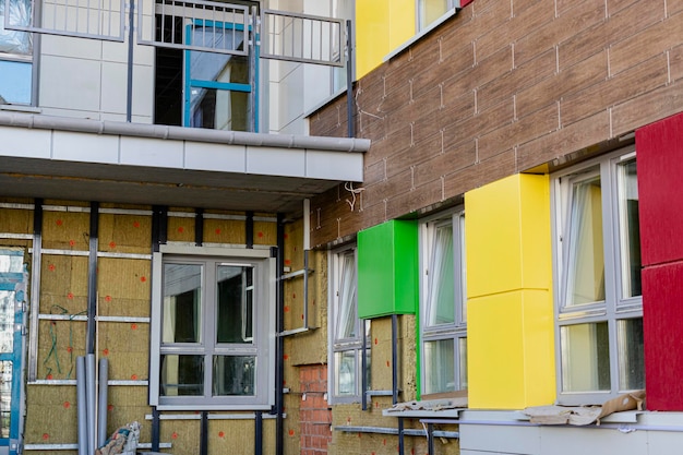 Power saving technology: plates of mineral wool on the side wall, between the metal profiles for attaching the ventilated facade.