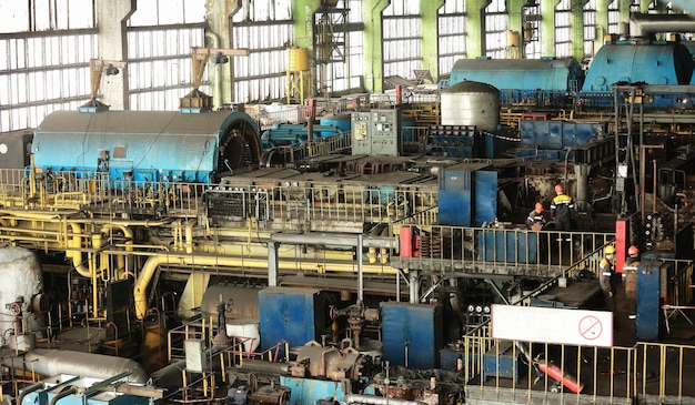 Power station Machine room in thermal power plant with electric generators and turbines