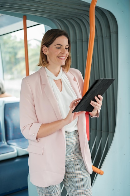 Powerful businesswoman using public transport to go to her job Concept business start investment