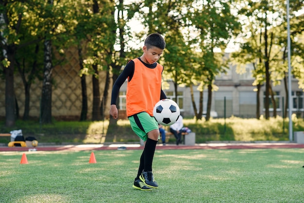 Practicing sport exercises at artificial stadium.