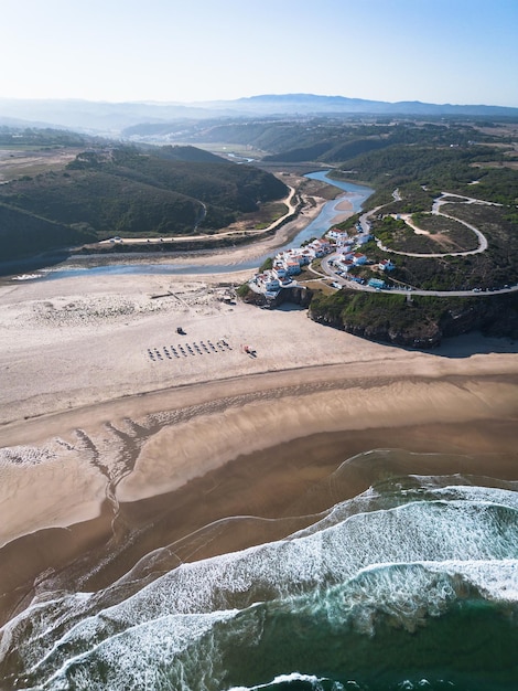 Praia de Odeceixe beach in Vicentine Coast Algarve Portugal aerial vertical shot