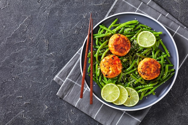 Prawn and Crab Cakes on a plate with green beans