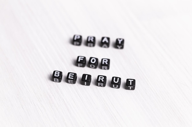 Pray for Beirut sign. Show of support in response to 2020 Lebanon Explosion. Message of solidarity and support. Words pray for Beirut on white background.