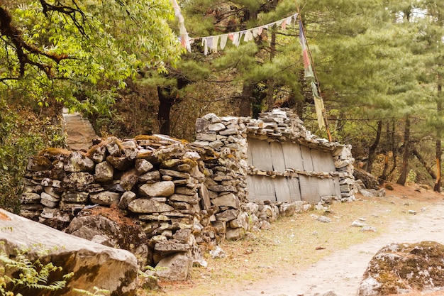 Prayer stone wall on the road in the Himalayas