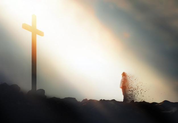 Photo praying christian of faith standing in front of bright light and cross of jesus christ