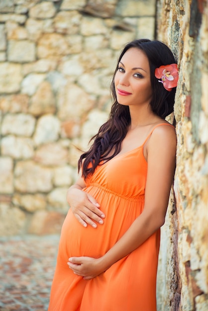 Pregnancy and travel. Holidays in the Dominican Republic. Pregnant girl on excursion in Altos de Chavon