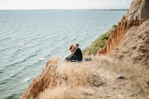 Pregnant girl and boyfriend on high hills