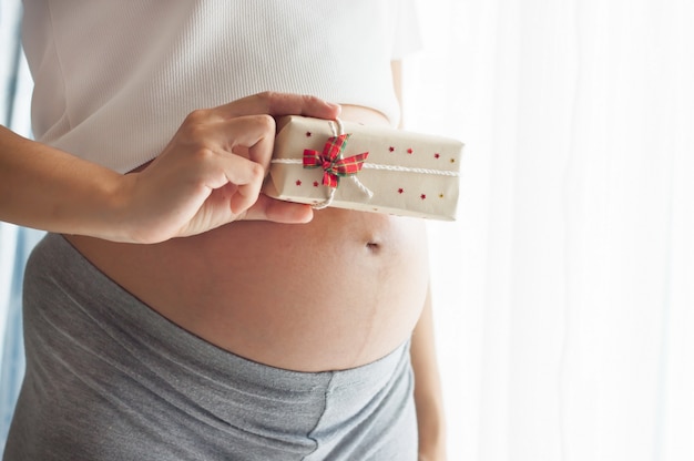 pregnant woman and gift box