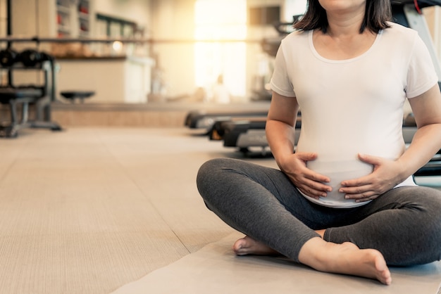 Pregnant woman in a gym