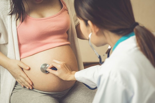 Pregnant Woman and Gynecologist Doctor at Hospital