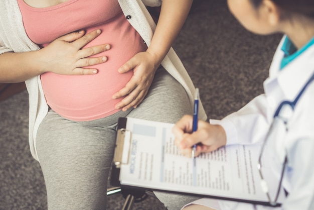 Pregnant Woman and Gynecologist Doctor at Hospital