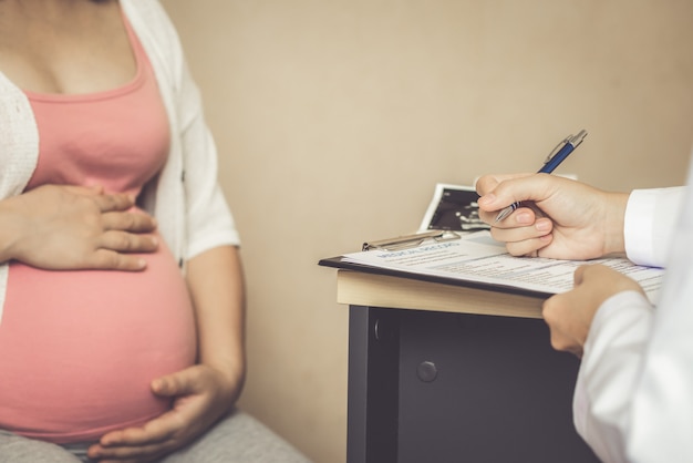 Pregnant Woman and Gynecologist Doctor at Hospital