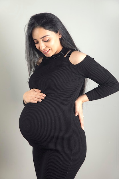 Pregnant woman hand on the belly