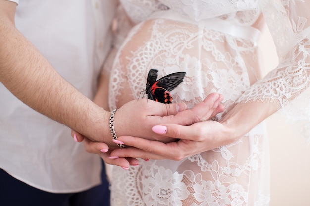 Pregnant woman holding her belly