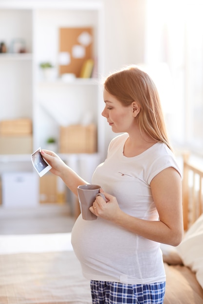 Pregnant Woman looking at Ultrasound Picture