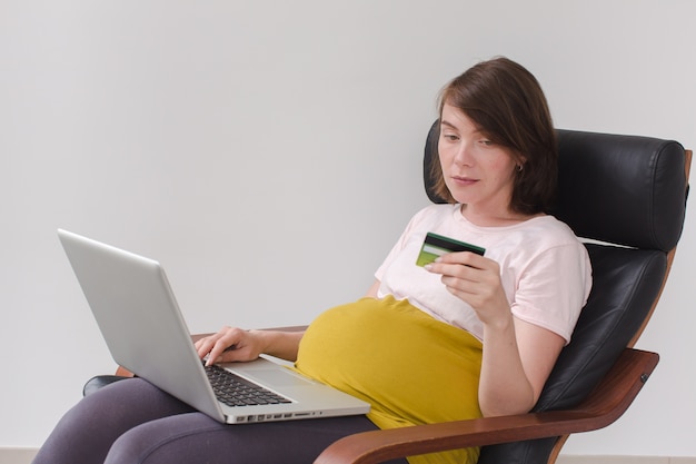 Pregnant woman makes a purchase on the Internet