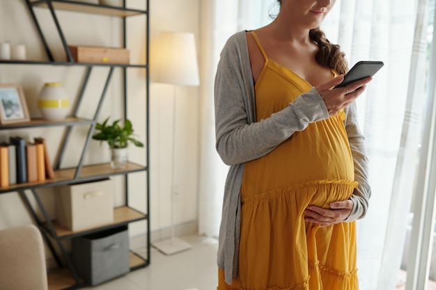 Pregnant Woman Making Doctors Appointment