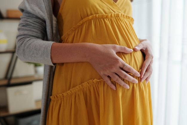 Pregnant Woman Making Heart Gesture