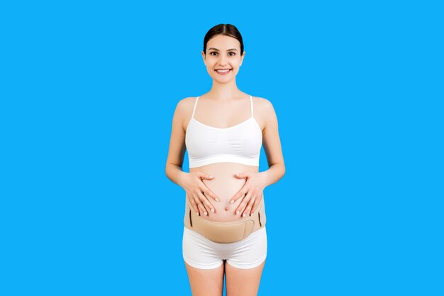 pregnant woman in orthopedic corset