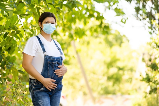 pregnant woman in a protective mask