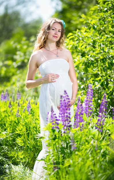 Pregnant woman relaxing and enjoying life in nature