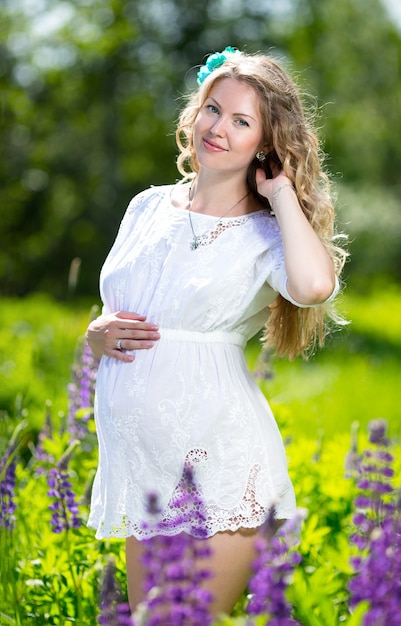 Pregnant woman relaxing and enjoying life in nature