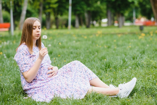 Pregnant woman resting in the park