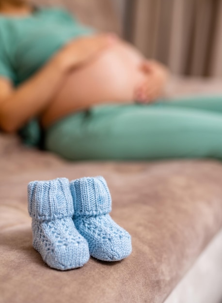 A pregnant woman shows a thumb up Baby mother healthcare