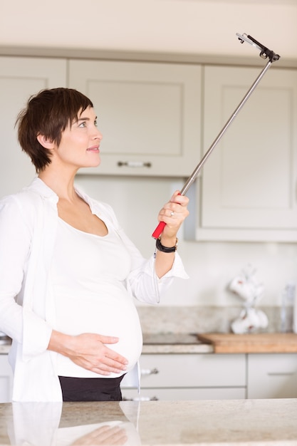 Pregnant woman taking a selfie