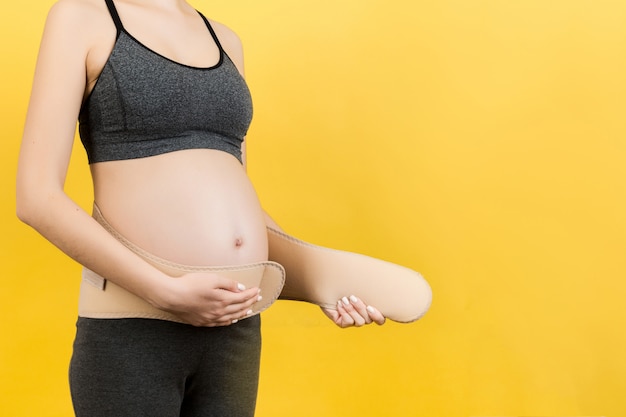 pregnant woman wearing elastic pregnancy bandage