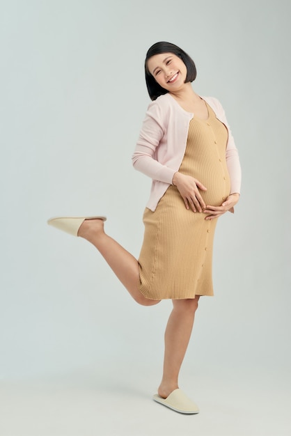 Pregnant woman wearing maternity dress