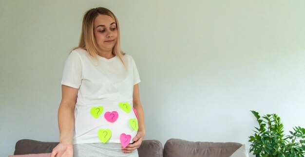 Pregnant woman who will be the question mark Selective focus