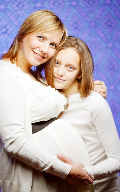 Pregnant woman with daughter