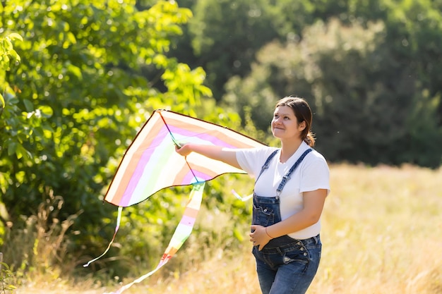 pregnant woman with a kite