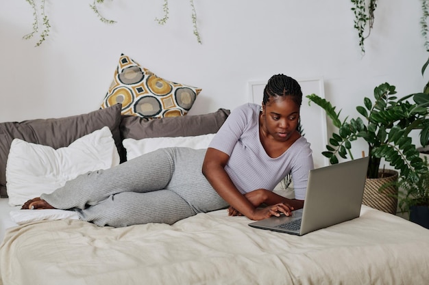 Pregnant woman working on laptop