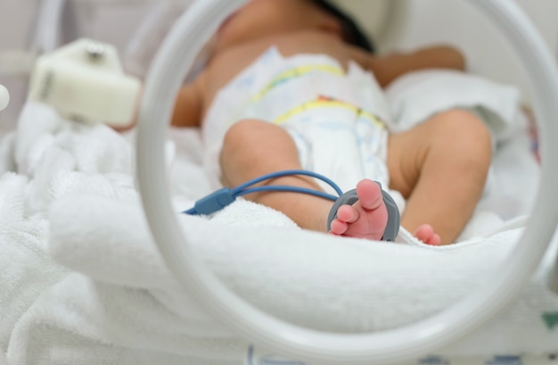 premature baby sleep inside incubator