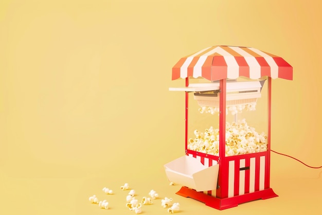 Photo premium popcorn machine with freshly popped popcorn ideal for home or events