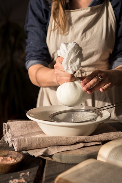 Preparation of almond milk from soaked and peeled nuts. Vegan Milk Alternative concept