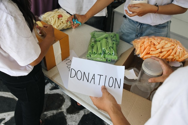 Photo preparation for charity event humanitarian activist packing food for donation