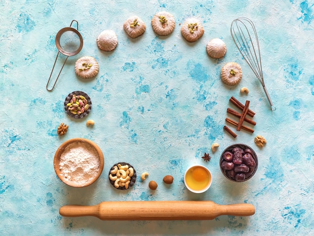 Preparation of cookies. Holidays food surface. Arab sweets are laid out on a blue table.