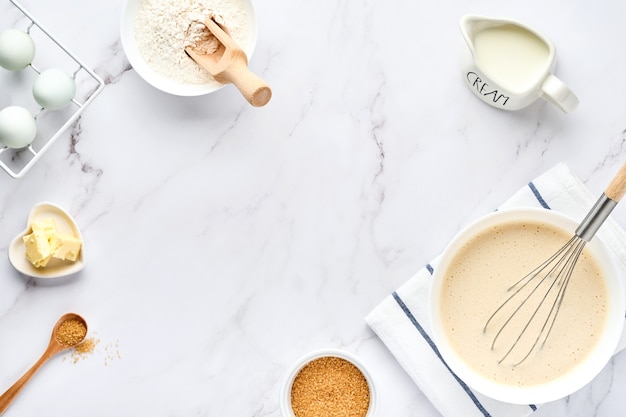 preparation of dough for home pancakes for breakfast or for maslenitsa. ingredients on the table  