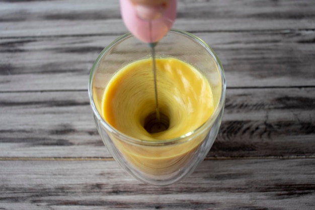 Preparation of golden milk with turmeric and other spices using a milk frother