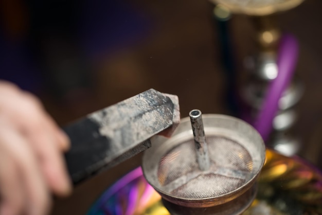 Preparation The Hookah With Charcoal For Smoking The Traditional HubbleBubble