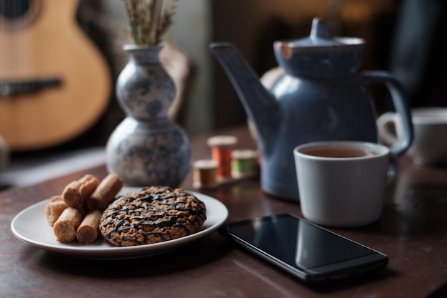 Preparation for morning tea A cup and a teapot on the table are