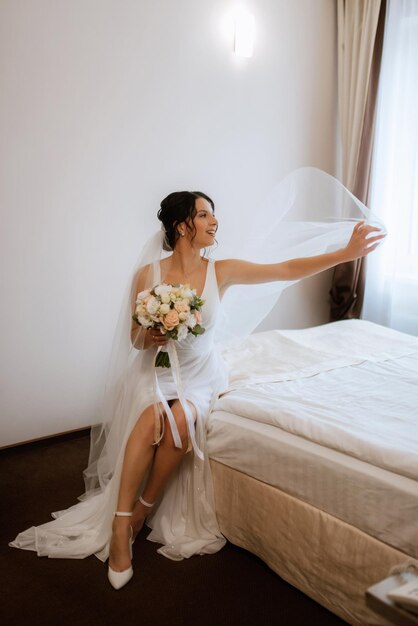 Preparations for the bride with the dressing of the wedding dress