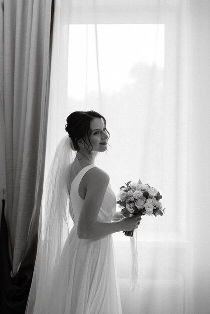 Preparations for the bride with the dressing of the wedding dress