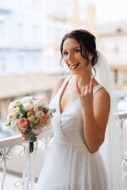 Preparations for the bride with the dressing of the wedding dress