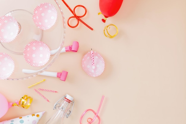 Preparing for birthday party Attributes of holiday on pink background Top view Copy space